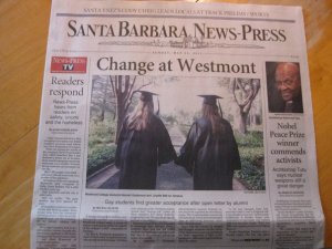 Lesbian Westmont students holding hands in caps & gowns